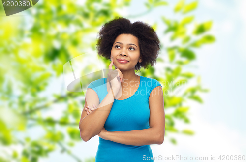 Image of happy afro american young woman over white