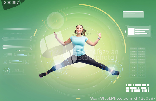 Image of happy smiling sporty young woman jumping in air