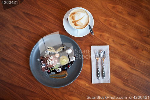 Image of chocolate ice cream dessert on plate at restaurant