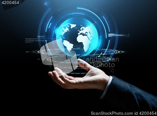 Image of businessman hand virtual earth projection