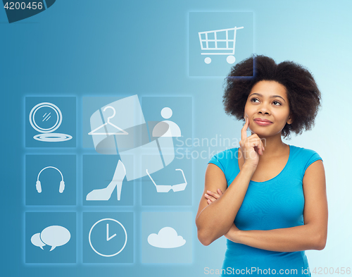 Image of happy afro american young woman with menu icons