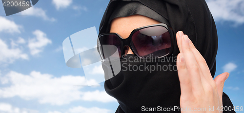 Image of close up of muslim woman in hijab and sunglasses