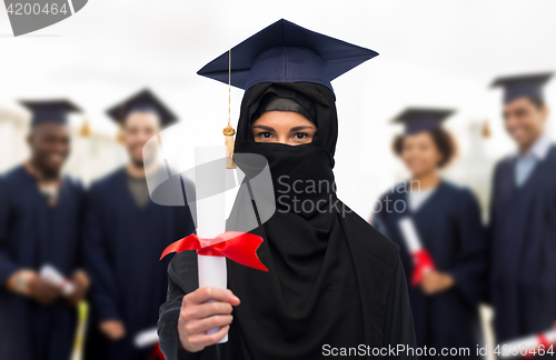 Image of muslim student woman in hijab with diploma