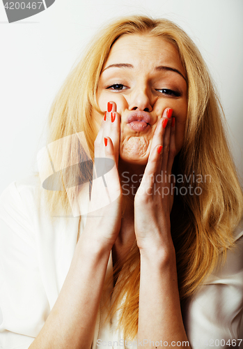 Image of young blond woman on white backgroung gesture thumbs up, isolate