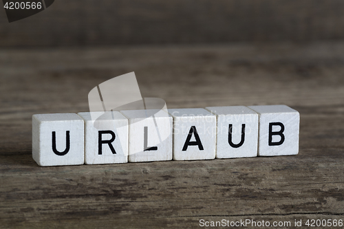 Image of German word vacation, written in cubes