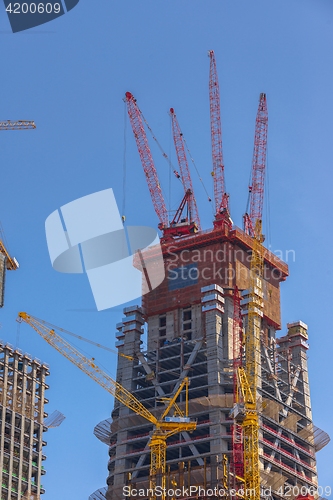 Image of Construction of skyscrapers under blue sky