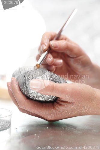 Image of Painting glass balls Christmas decorations.