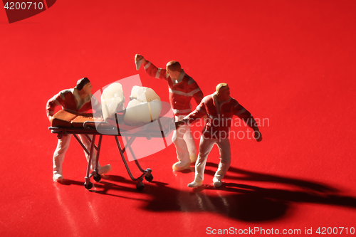 Image of Miniature Workers Performing Dental Procedures. Dental Office Ar