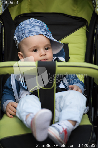 Image of baby boy sitting in the pram