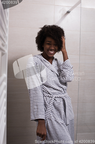 Image of beautiful black woman wearing  bathrobe