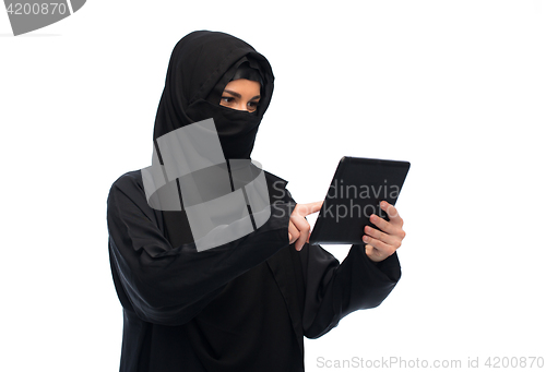 Image of muslim woman in hijab with tablet pc computer