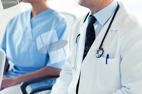 Image of close up of happy doctors at seminar or hospital