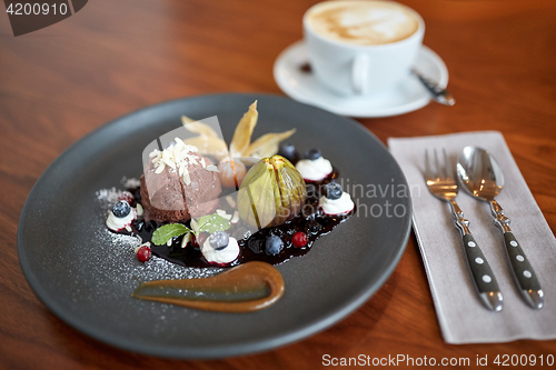 Image of chocolate ice cream dessert on plate at restaurant