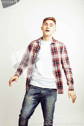Image of young handsome teenage hipster guy posing emotional, happy smiling against white background isolated, lifestyle people concept
