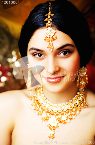 Image of beauty sweet real indian girl in sari smiling on black backgroun