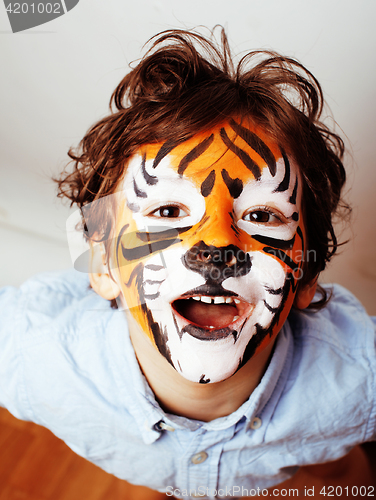 Image of little cute boy with faceart on birthday party close up, little 