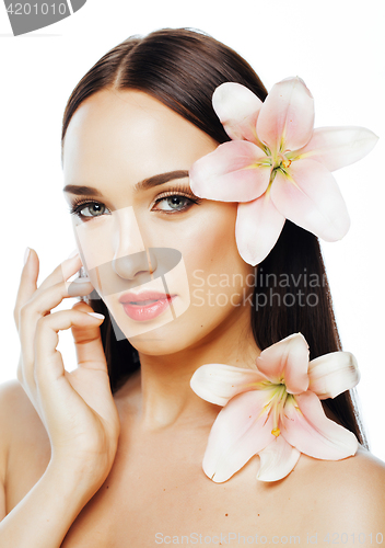 Image of young attractive lady close up with hands on face isolated flowe