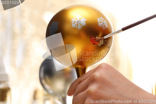 Image of Decorating baubles, handmade Painting of Christmas decorations