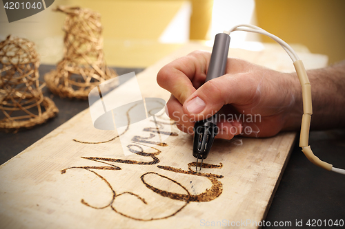 Image of Pyrography, wood burning inscriptions 