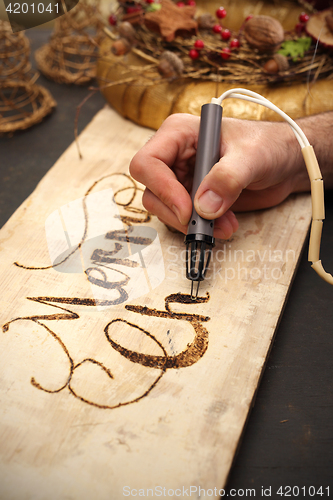 Image of Pyrography, wood burning inscriptions 