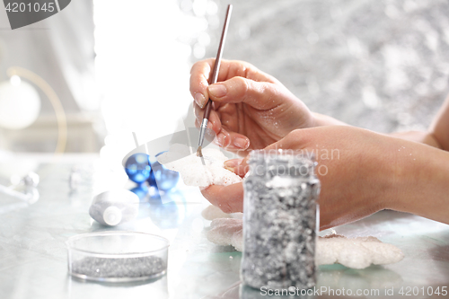 Image of The glass bauble Christmas Tree decorated with glitter in art studio