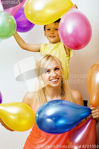 Image of pretty real family with color balloons on white background, blon