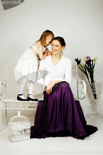 Image of young mother with daughter at luxury home interior vintage