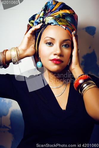 Image of beauty bright african woman with creative make up, shawl on head