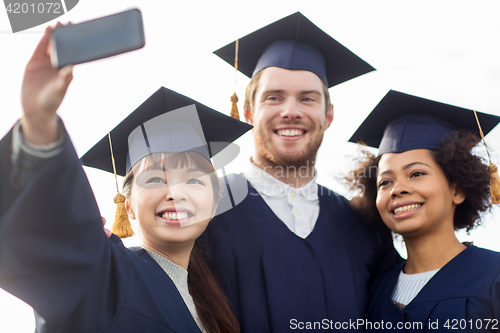 Image of students or bachelors taking selfie by smartphone