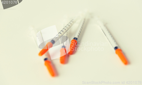 Image of close up of insulin syringes on table