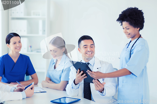 Image of group of happy doctors meeting at hospital office