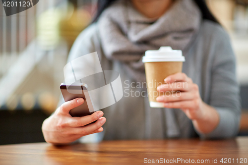 Image of close up of woman with smartphone and coffee