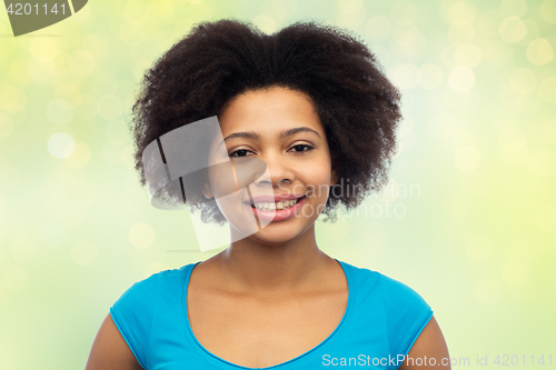 Image of happy african american young woman over white