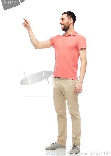 Image of happy man touching something imaginary