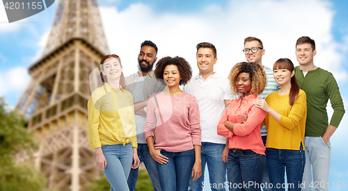 Image of international group of people over eiffel tower