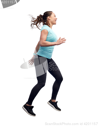 Image of happy smiling sporty young woman jumping in air