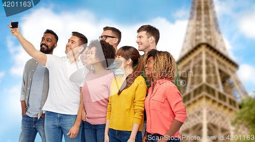 Image of group of people taking selfie by smartphone