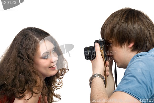 Image of Photographer taking pictures of the young woman. isolated 3