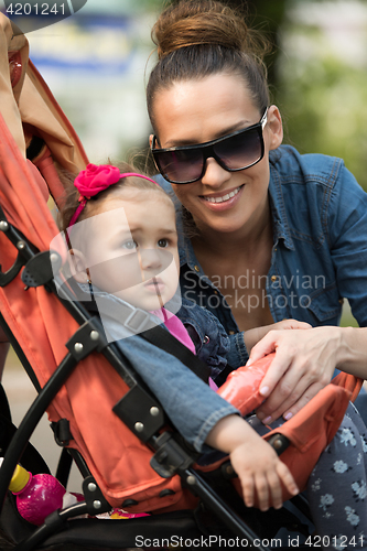 Image of mother and baby in the park