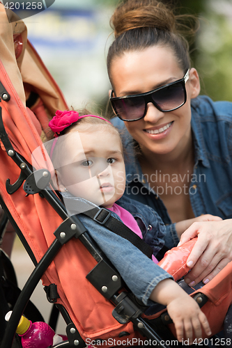 Image of mother and baby in the park