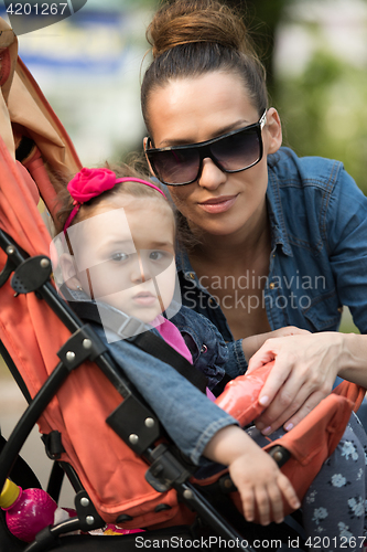 Image of mother and baby in the park