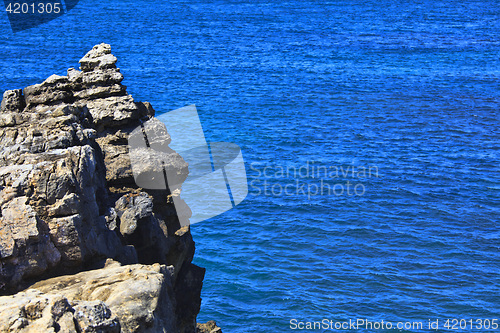 Image of Rocky Coast Extending into the Sea