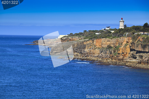 Image of Rocky Coast Extending into the Sea