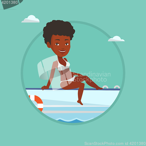 Image of Young happy woman tanning on sailboat.