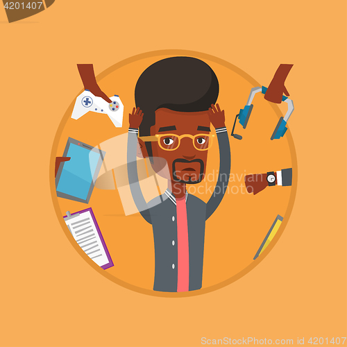 Image of Young man surrounded with his gadgets.