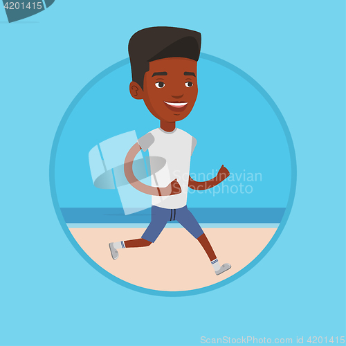 Image of Young sporty man jogging on the beach.