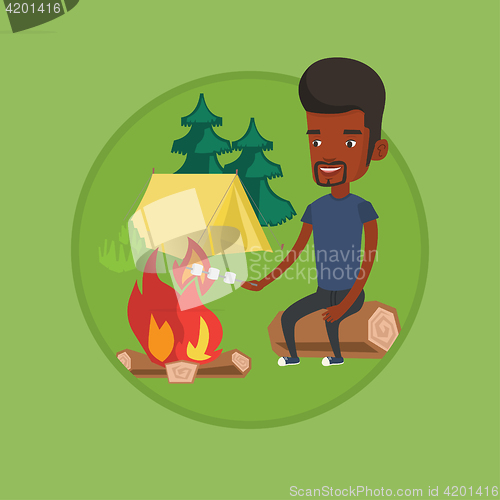 Image of Businessman roasting marshmallow over campfire.