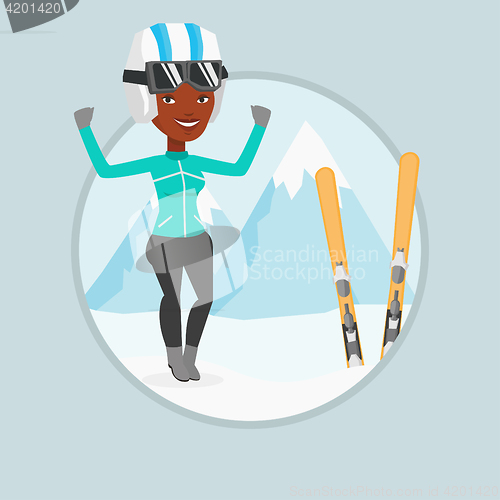 Image of Cheerful skier standing with raised hands.