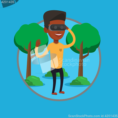 Image of Man wearing virtual reality headset in the park.