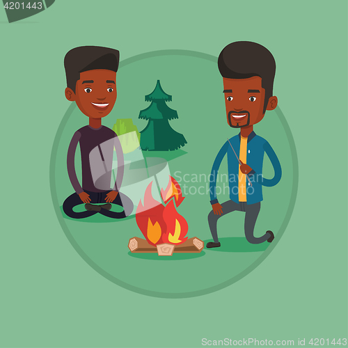 Image of Two friends sitting around bonfire in camping.